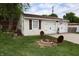Detached two car garage with a cozy firepit nearby at 76 Manhattan Ave, Indianapolis, IN 46241