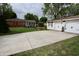 View of home's exterior and detached garage with double doors, perfect for extra storage or workshop at 76 Manhattan Ave, Indianapolis, IN 46241