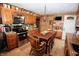 Spacious kitchen featuring oak cabinets, stainless steel appliances and eat-in dining area at 76 Manhattan Ave, Indianapolis, IN 46241