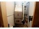 Utility Room featuring a modern furnace and water heater system, ensuring efficient home operation at 76 Manhattan Ave, Indianapolis, IN 46241