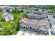 Aerial view showcasing modern townhomes with lush landscaping and convenient access to nearby amenities at 8245 Bostic Dr, Fishers, IN 46038