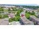 Beautiful aerial view of the townhomes in a park-like setting with pond and mature trees at 8245 Bostic Dr, Fishers, IN 46038