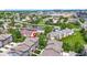 Scenic aerial view of townhomes with pond, landscaping, and city views at 8245 Bostic Dr, Fishers, IN 46038