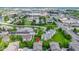 An aerial view highlighting a community with landscaping, a nearby lake, shopping and easy access to the highway at 8245 Bostic Dr, Fishers, IN 46038