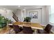 Bright dining room with modern decor, a wooden table set, and lots of natural light at 8245 Bostic Dr, Fishers, IN 46038