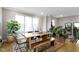 Spacious dining room with a wooden table set, indoor plants, and plenty of natural light at 8245 Bostic Dr, Fishers, IN 46038