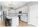 Stylish kitchen with white cabinets, stainless steel appliances, granite counters, and an island with seating at 8245 Bostic Dr, Fishers, IN 46038