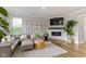 Cozy living room with a plush sectional sofa, fireplace, and modern decor at 8245 Bostic Dr, Fishers, IN 46038