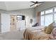 Main bedroom suite featuring vaulted ceiling, large windows, and an adjoining study/office area at 8245 Bostic Dr, Fishers, IN 46038