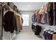 Large walk-in closet with ample hanging space and built-in shelving at 8245 Bostic Dr, Fishers, IN 46038