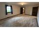 Bedroom with a window to the outside and multiple access points to closets and hallways at 830 Millerwood Dr, Lebanon, IN 46052