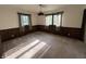 Bedroom with wood paneled walls and 2 windows that let in lots of natural light at 830 Millerwood Dr, Lebanon, IN 46052