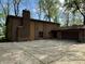 The large concrete driveway leads to a two-car garage with brick and siding exterior at 830 Millerwood Dr, Lebanon, IN 46052