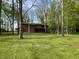 A beautiful two-story home sits amongst a grassy lawn and mature trees at 830 Millerwood Dr, Lebanon, IN 46052