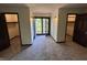 Hallway with access to two bedrooms and a set of french doors leading to the outside at 830 Millerwood Dr, Lebanon, IN 46052