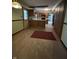 Eat-in kitchen with vinyl flooring, modern appliances and access to backyard at 830 Millerwood Dr, Lebanon, IN 46052