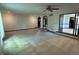Spacious living room with neutral carpeting, large windows, and views to other rooms at 830 Millerwood Dr, Lebanon, IN 46052