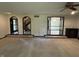 Open-concept living room featuring neutral walls and carpet with views to multiple rooms at 830 Millerwood Dr, Lebanon, IN 46052
