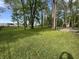Beautiful, expansive green lawn dotted with mature trees in a well-maintained landscape at 830 Millerwood Dr, Lebanon, IN 46052