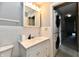 Bathroom with vanity, mirrored cabinet, and stacked washer and dryer at 8360 Paso Del Norte Ct, Indianapolis, IN 46227