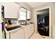 Well-lit kitchen with stainless steel sink and modern dishwasher at 8360 Paso Del Norte Ct, Indianapolis, IN 46227