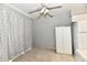 This bright living room features a ceiling fan at 8360 Paso Del Norte Ct, Indianapolis, IN 46227