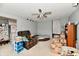 Spacious living room with ceiling fan and a neutral color scheme at 8360 Paso Del Norte Ct, Indianapolis, IN 46227
