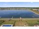 Aerial view of the lake surrounded by residential properties with docks and piers at 8644 S Tibbs Ave, Indianapolis, IN 46217