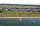 Aerial view showing houses and a dock on the lake at 8644 S Tibbs Ave, Indianapolis, IN 46217