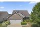 Charming brick home with a well-manicured lawn, showcasing its inviting curb appeal at 8644 S Tibbs Ave, Indianapolis, IN 46217