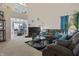 Inviting living room features a cozy fireplace, plush seating, and a soaring two-story ceiling for a spacious feel at 8644 S Tibbs Ave, Indianapolis, IN 46217
