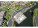 Aerial view featuring a pool with lounge chairs beside a pond at 8751 Jaffa Court East Dr # Apt 32, Indianapolis, IN 46260