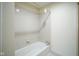 A clean, white bathtub with tiled walls, featuring a showerhead with bright lighting at 8751 Jaffa Court East Dr # Apt 32, Indianapolis, IN 46260