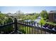 Scenic community view featuring a pond, manicured lawns, and surrounding residential buildings on a sunny day at 8751 Jaffa Court East Dr # Apt 32, Indianapolis, IN 46260