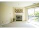 Living room fireplace featuring a sliding door to the balcony at 8751 Jaffa Court East Dr # Apt 32, Indianapolis, IN 46260