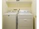 Laundry room featuring a Maytag washer and dryer set with shelf storage at 8751 Jaffa Court East Dr # Apt 32, Indianapolis, IN 46260