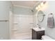 Bathroom featuring a tub with shower, vanity with modern fixtures, and neutral color scheme at 916 S Outer Dr, Lebanon, IN 46052