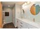 Bathroom featuring double sinks with brass hardware, white cabinets, and modern fixtures at 916 S Outer Dr, Lebanon, IN 46052