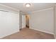 Neutral bedroom with carpeted flooring and a double-door closet at 916 S Outer Dr, Lebanon, IN 46052