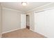 Neutral-toned bedroom with carpeted flooring and double-door closet at 916 S Outer Dr, Lebanon, IN 46052