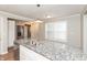 Kitchen featuring white cabinets, stainless steel appliances, and granite countertops at 916 S Outer Dr, Lebanon, IN 46052