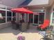 Outdoor patio with a dining set under a red umbrella, creating a comfortable and inviting space for outdoor dining at 9789 Rue Renee Ln, McCordsville, IN 46055