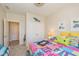 Bright bedroom with coastal accents, colorful bedspread, and plenty of closet space at 9789 Rue Renee Ln, McCordsville, IN 46055