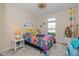 Bright bedroom with colorful decor, unique light fixture, and ample natural light at 9789 Rue Renee Ln, McCordsville, IN 46055