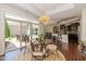 Open dining room with sliding doors to the patio and views of the kitchen at 9789 Rue Renee Ln, McCordsville, IN 46055