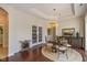 Elegant dining room with hardwood floors, decorative lighting, and access to the patio at 9789 Rue Renee Ln, McCordsville, IN 46055