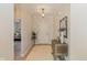 Inviting foyer featuring neutral walls, elegant lighting, and stylish decor at 9789 Rue Renee Ln, McCordsville, IN 46055