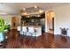 Spacious kitchen featuring an island with bar stool seating, dark wood cabinets, and modern appliances at 9789 Rue Renee Ln, McCordsville, IN 46055