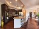 Modern kitchen featuring a large island with seating, stainless steel appliances, and stylish cabinetry at 9789 Rue Renee Ln, McCordsville, IN 46055