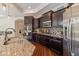 Stunning kitchen features dark cabinetry, granite counters, and modern appliances at 9789 Rue Renee Ln, McCordsville, IN 46055
